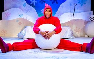 man with giant snowball
