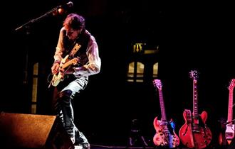 man playing guitar