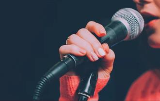 Photo of a singer and a microphone