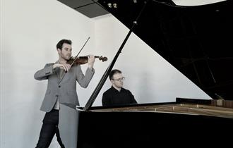 Violinist Miguel Suay (left) and pianist Patryk Frac (right)