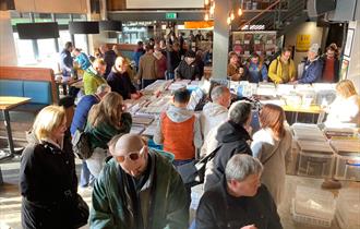 Vinyl collectors look through boxes and boxes of records