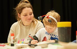 Young child taking part in a craft session