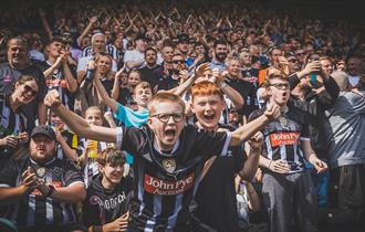 Notts County fans celebrating.