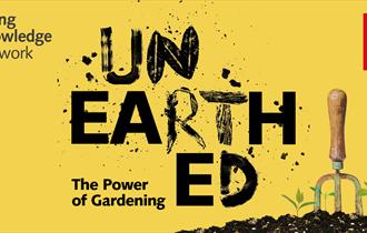 Yellow rectangle with Unearthed the Power of Gardening in text with a picture of a trowel