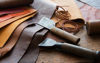 tan coloured leather and tools