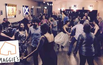 Photo of a crowd dancing at a ceilidh