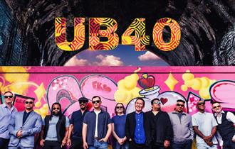 Event poster featuring band members standing in front of a pink wall with graffiti