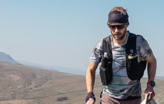 Ultrarunner Damian Hall in a remote, mountaintop setting
