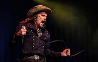 Photo of Adam Ant on stage