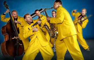 Photo of the jive aces in yellow suits