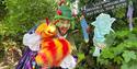 Man dressed up in front of a forest