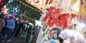 Picture of funfair stall with people in background