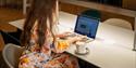 Photo of a woman using the media lounge