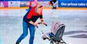 Photo of a dad with a stroller on the ice