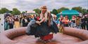 A person riding the rodeo bull