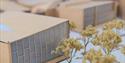 cardboard architectural models with small trees