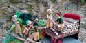 Yarn scene showing Land Girls moving logs onto a lorry