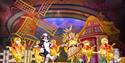 Jack and the Beanstalk – A hand-painted, storybook style set of a farm. Six members of the Youth Chorus, all dressed as chickens, stand in a line. In