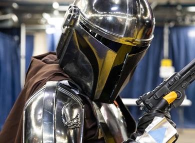 A photo of a cosplayer dressed as Mando from Star Wars