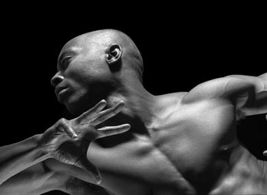 Top half of a male ballet dancer striking a pose