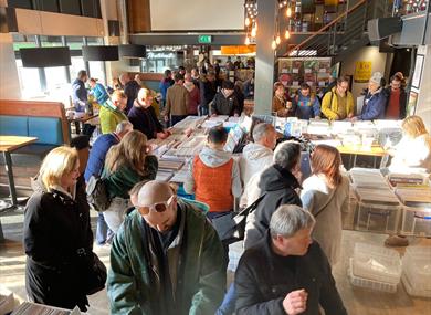 Vinyl collectors look through boxes and boxes of records