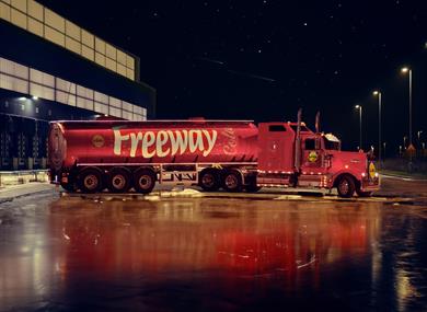 A big red truck with Lidl Freeway Cola written on the side