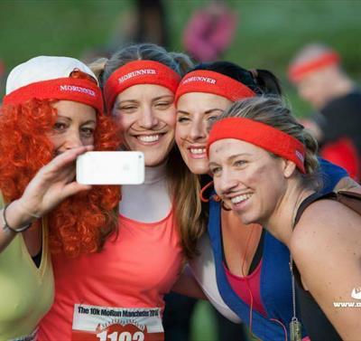 Photo of runners taking a selfie. They are all smiling and some are in fancy dress.
