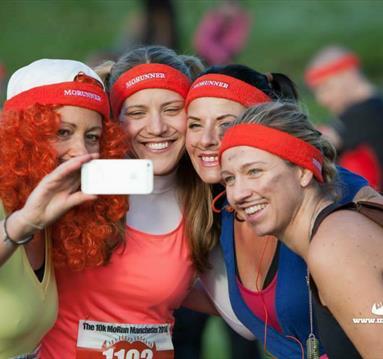 Photo of runners taking a selfie. They are all smiling and some are in fancy dress.
