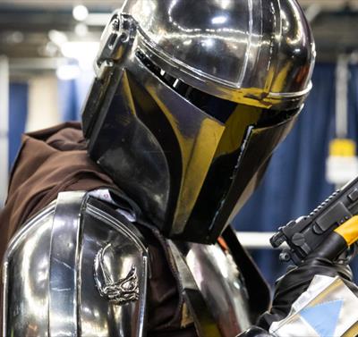 A photo of a cosplayer dressed as Mando from Star Wars