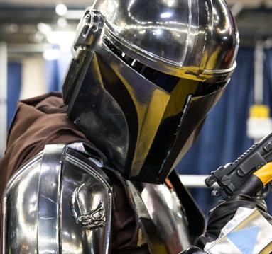A photo of a cosplayer dressed as Mando from Star Wars