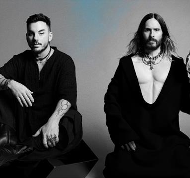 Black and White photo of Thirty Seconds to Mars. Jared Leto is holding an owl.