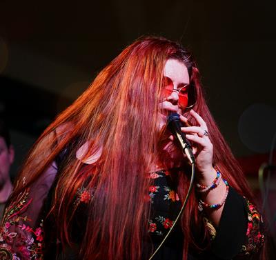 Photo of Alice Armstrong performing on stage