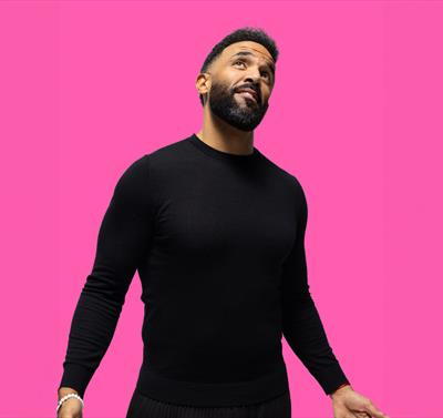 Photo of Craig David against a pink background