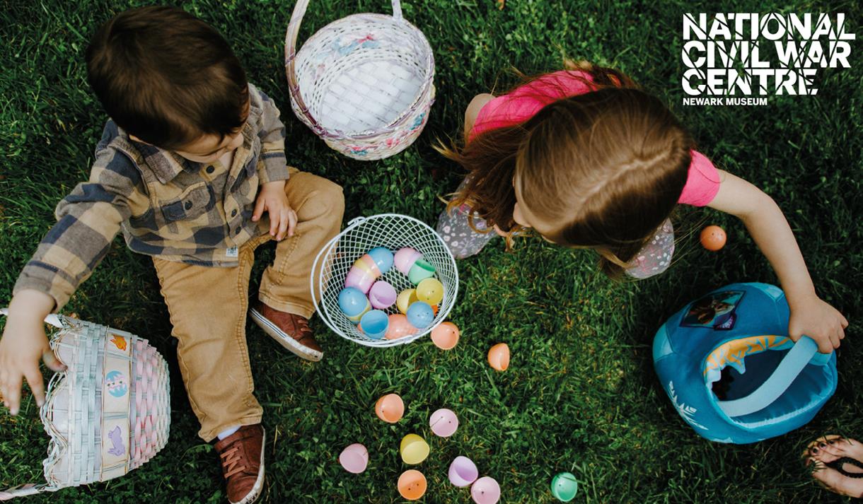 Photo of children playing with easter eggs in baskets.
