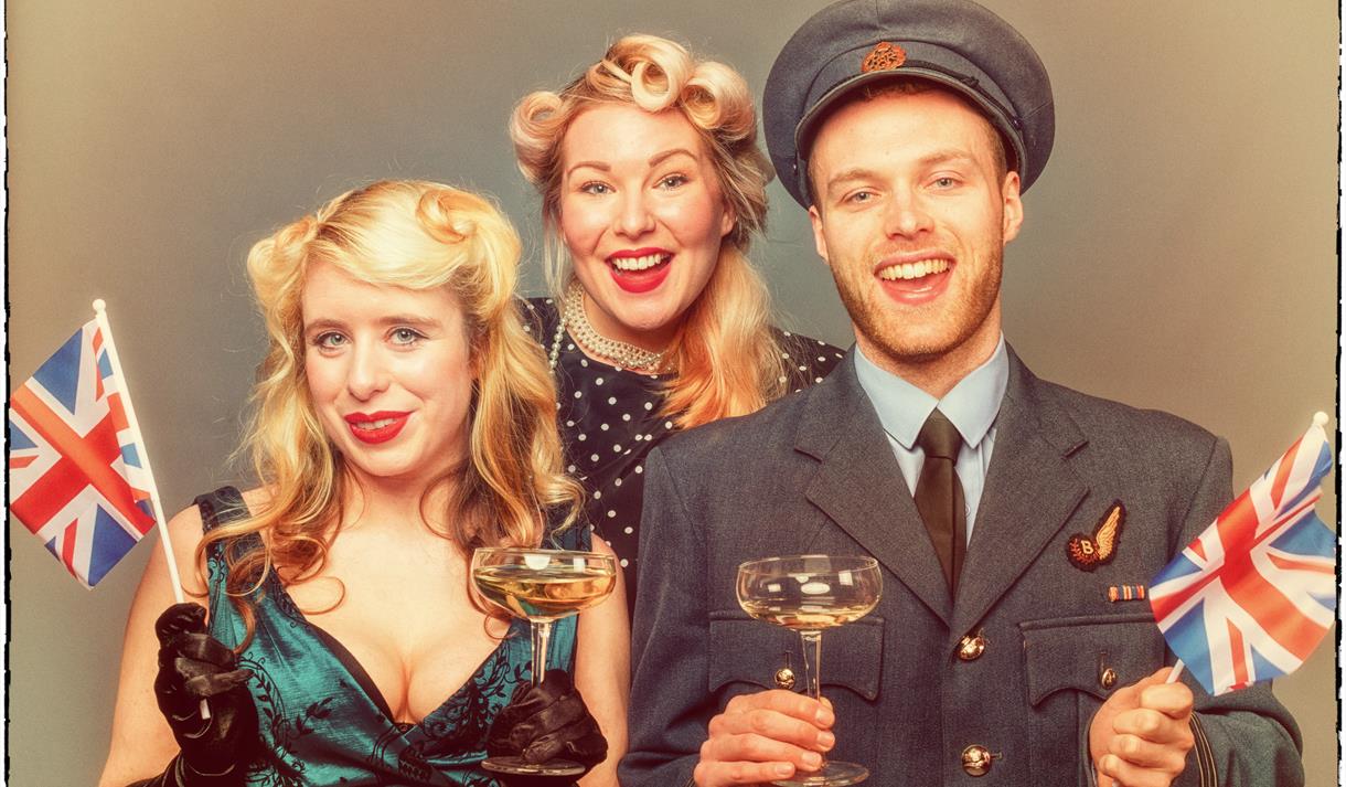 People dressed in 1940s attire.