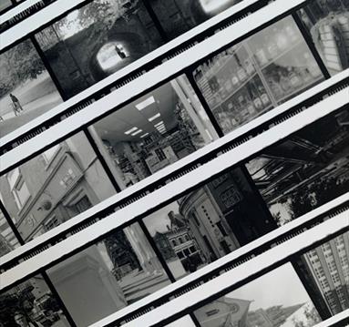 The image shows a series of black and white photos of buildings. 