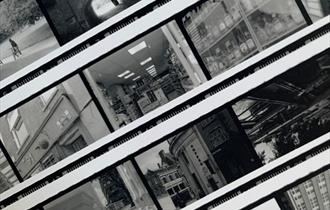 The image shows a series of black and white photos of buildings.