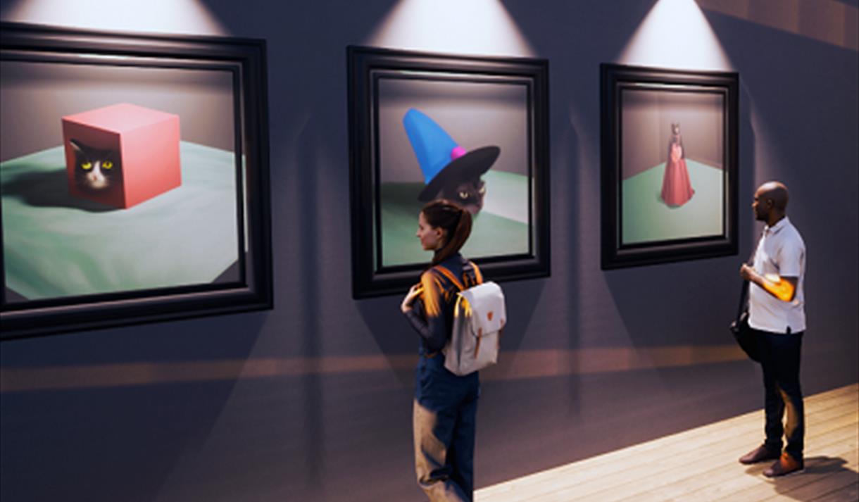 The image shows two people looking at three paintings on the wall.