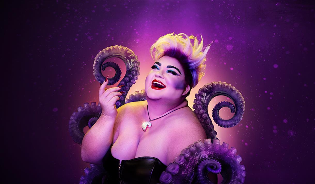 The image shows Ursula the sea witch, a large purple octopus in a black dress with black and purple tentacles around her