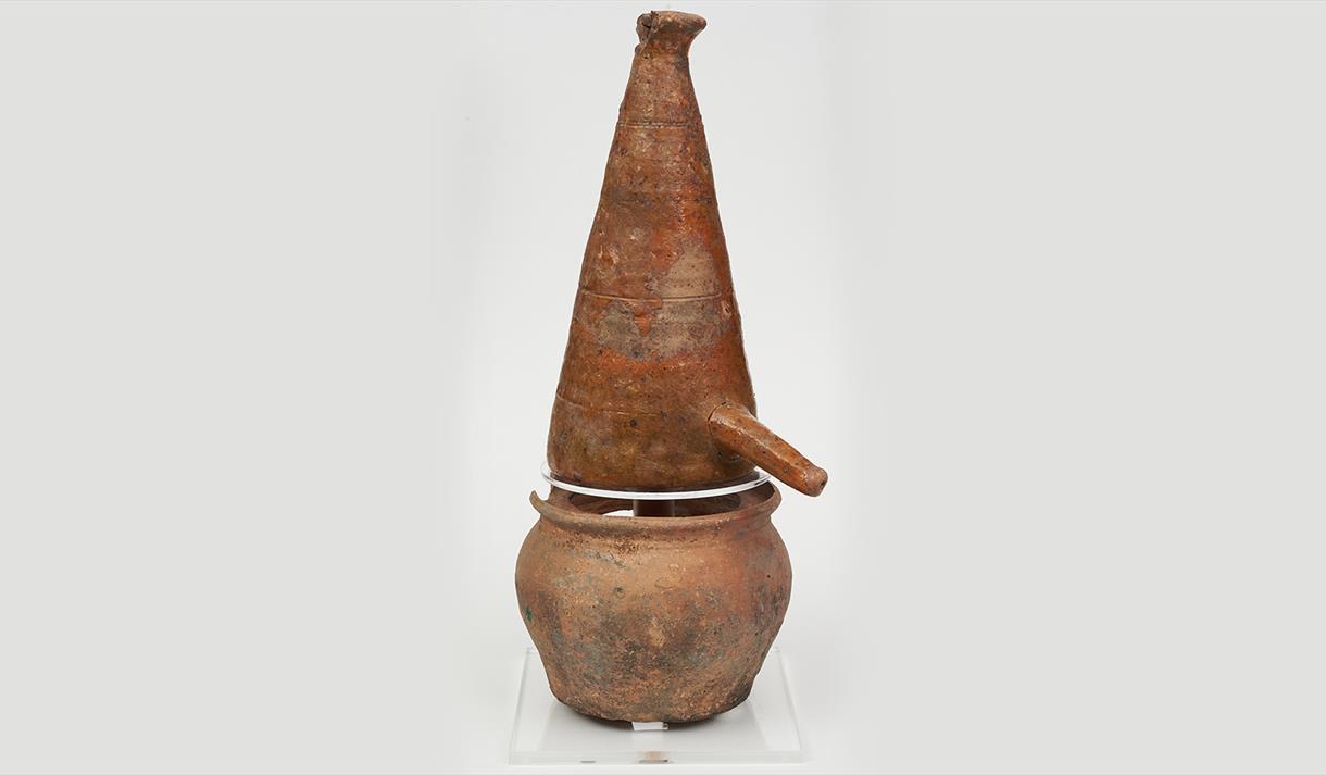 A medieval alembic, a conical shaped distillation vessel