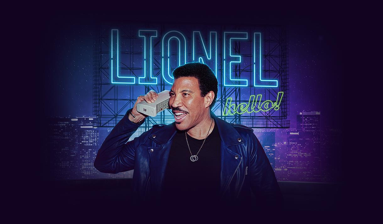 Official Lionel Richie concert artwork, consisting of Lionel using a retro phone in front of a neon sign that says "LIONEL hello!"