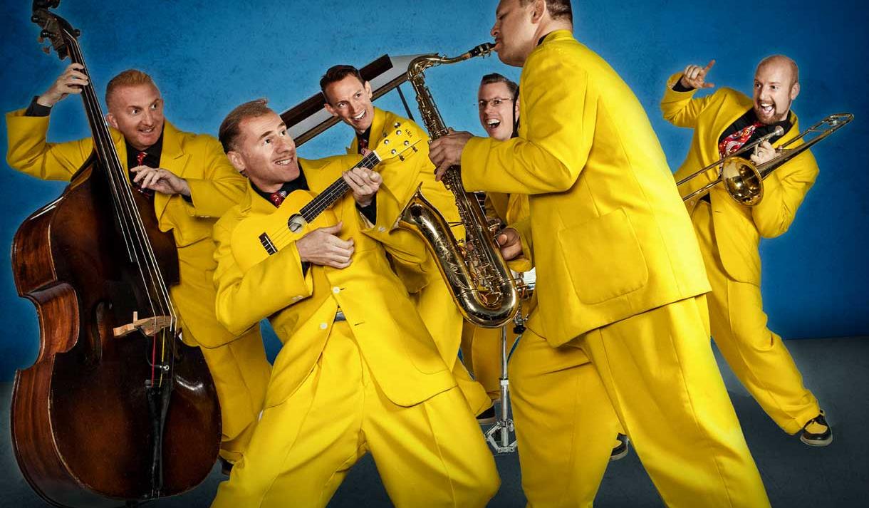 Photo of the jive aces in yellow suits