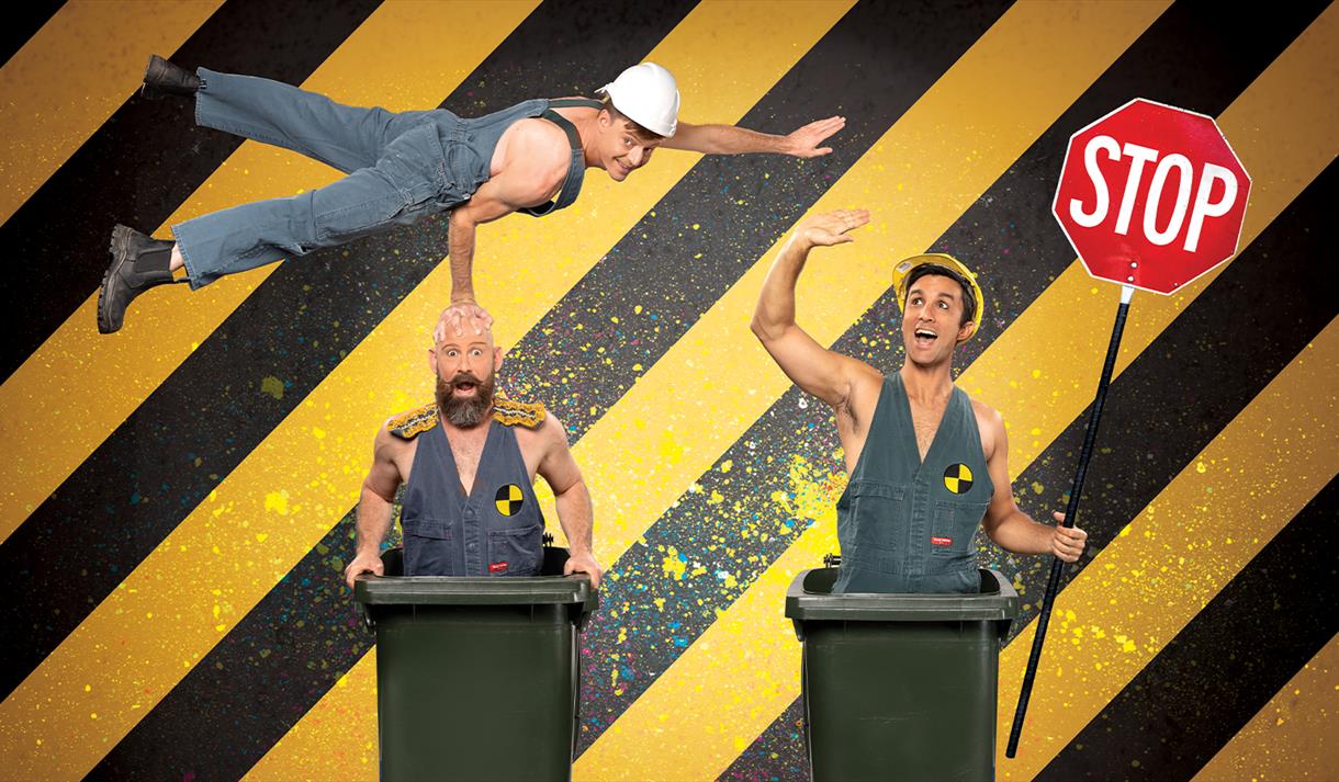 Graphic of the Trash Test Dummies Circus show featuring two of the perfromers stood in bins and the third flying above them.
