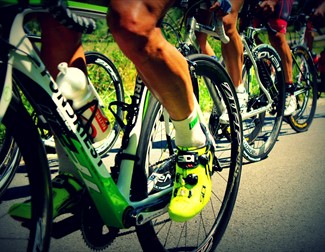 images of bike wheels and cyclists legs