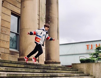 Boy ready to leap off town hall steps