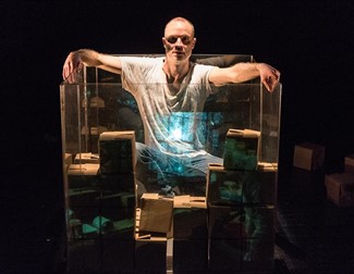 actor surrounded by empty boxes