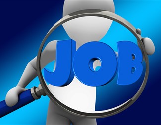 person with magnifying glass looking at the word JOB