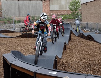 kids on bikes on the pump track