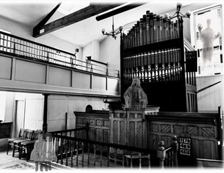 Black and white ghostly image of chapel interior