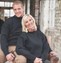 lady and gent wearing matching jumpers knitted